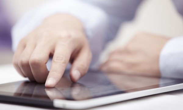 Mobile business Hands of businessman using tablet PC at office